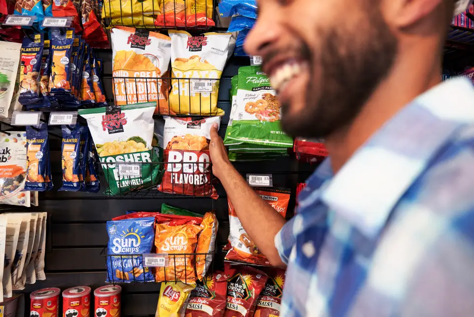 Man buying items from store