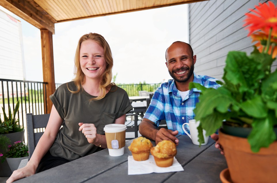 Couple eating breakfast on patio