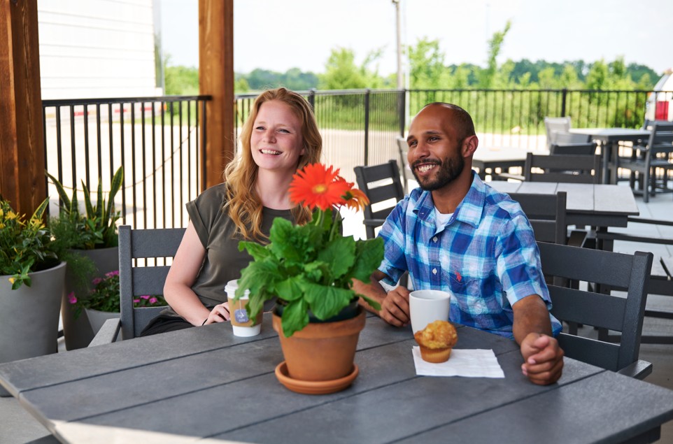 Couple eating breakfast on patio